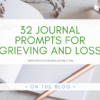 text that reads "32 Journal Prompts for Grieving and Loss" over a stock photo of a blank journal page and a gold pen.