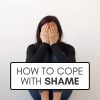 A graphic that reads how to cope with shame over a stock photo of a white woman wearing all-black sitting against a white background with her hands covering her face.