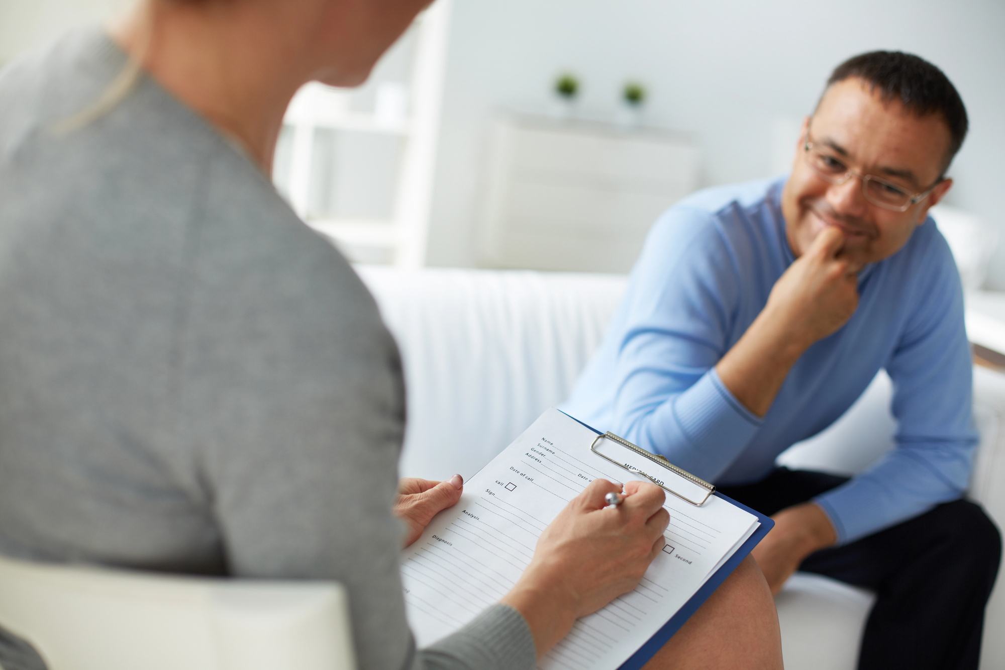 FFD Evaluation 1 Psychologist conducting a psychological fitness for duty evaluation in Houston with a male client during a clinical interview session