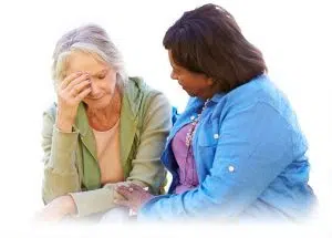 Woman Comforting Unhappy Senior Friend Outdoors